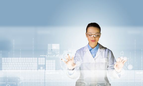 Image of young woman scientist touching icon of media screen