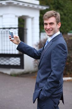 Portrait of young attractive man calling by phone