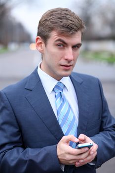 Portrait of young attractive man calling by phone