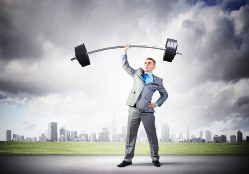 Image of strong businessman lifting barbell above head with one hand