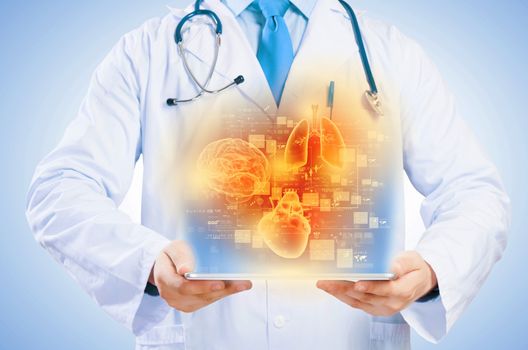 Close up of doctor's body holding tablet pc with media illustration