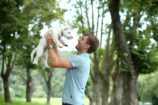 Young man and his adorable little dog