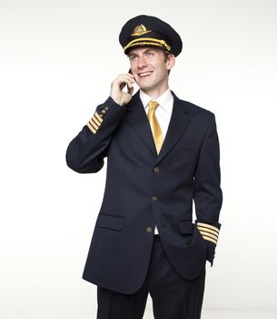 Portrait of a young man in the form of a passenger plane pilot