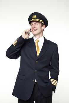 Portrait of a young man in the form of a passenger plane pilot