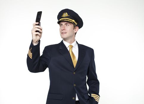 Portrait of a young man in the form of a passenger plane pilot