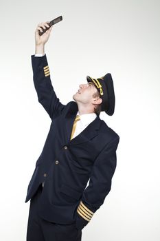 Portrait of a young man in the form of a passenger plane pilot