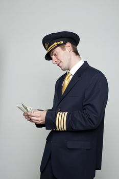 Portrait of a young man in the form of a passenger plane pilot