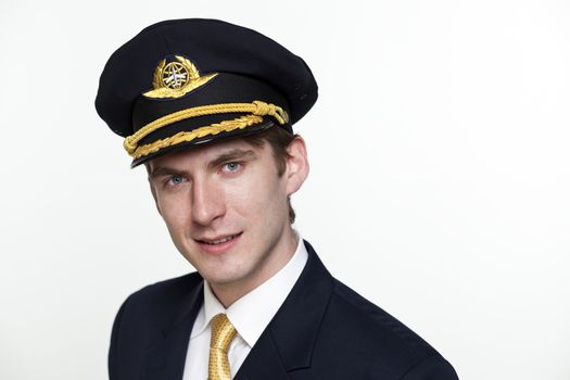 Portrait of a young man in the form of a passenger plane pilot