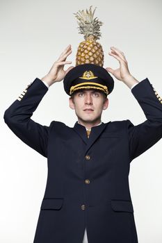 Portrait of a young man in the form of a passenger plane pilot