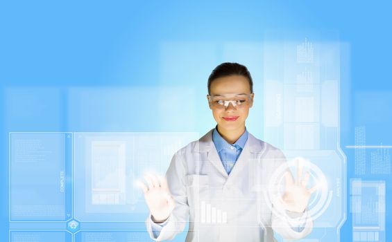 Image of young woman scientist touching icon of media screen