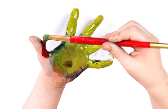 Little Girl Painting On Her Hand on the White Background