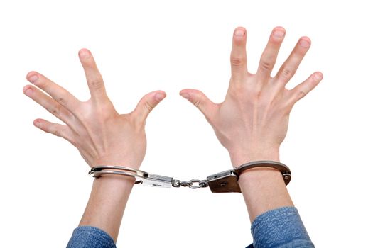 Handcuffs on Hands with wide apart fingers. Isolated on the White Background