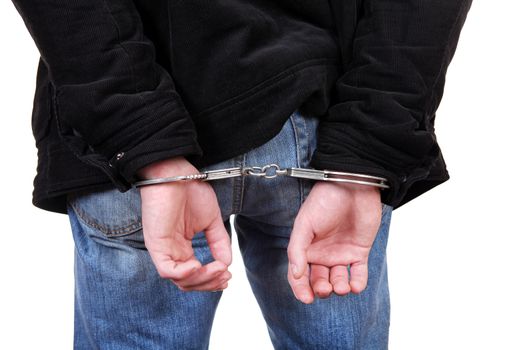 Rear view of the Man in Handcuffs on the White Background Closeup