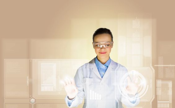 Image of young woman scientist touching icon of media screen