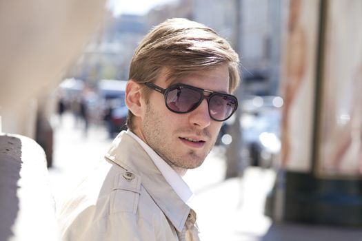 Portrait of young attractive man, outdoors