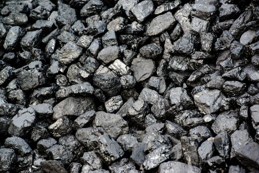 A pile of black coal from mining pit - background