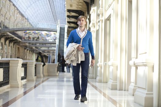 Young man walking in the store