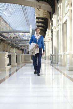 Young man walking in the store