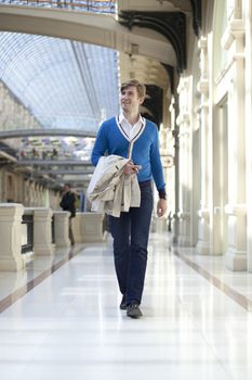 Young man walking in the store