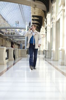 Young man walking in the store