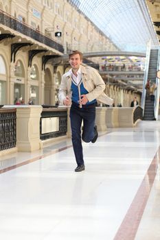 Young man running in the store