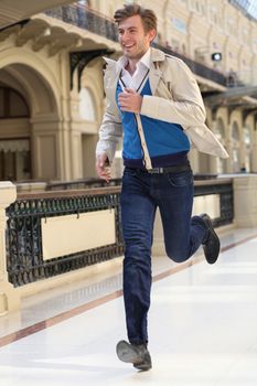 Young man running in the store