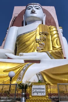 The Kyeik Pun Pagoda in Bago in Myanmar. This pagoda has four giant Buddha statues facing to the four points of the compass.