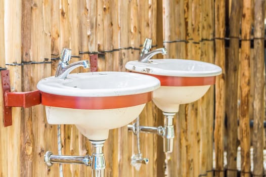 Wash basin fitted with natural wood.