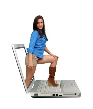 A lovely young brunette steps out of the screen onto the keyboard of a laptop computer.  Isolated on a white background with generous copyspace.