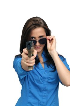 A lovely young brunette points a modern handgun at the camera.  Selective focus on the handgun.  Isolated on a white background with generous copyspace.