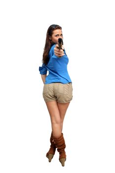 A lovely young brunette holds a modern handgun.  Isolated on a white background with generous copyspace.