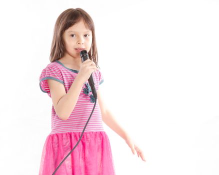 Asian female child singing with a microphone