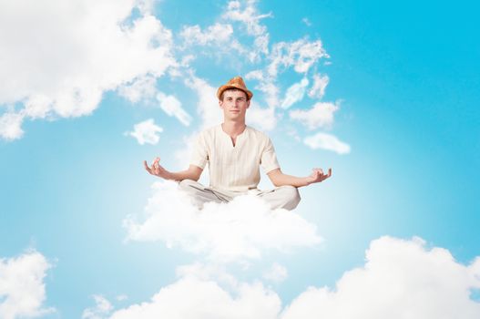 Image of young man sitting on clouds in lotus pose