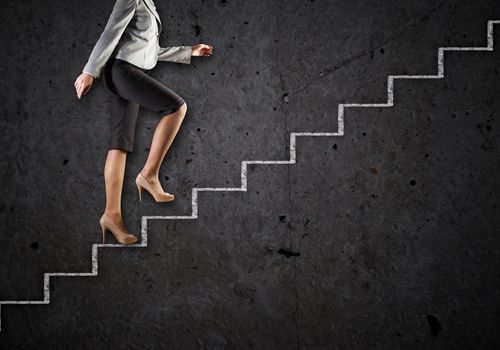 Image of businesswoman climbing career ladder. Success and achievement