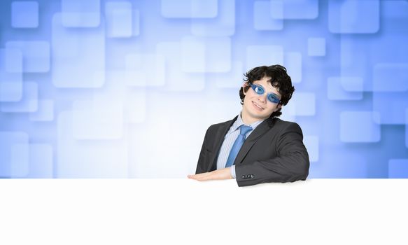 Image of businessman in goggles with blank white banner. Place for text