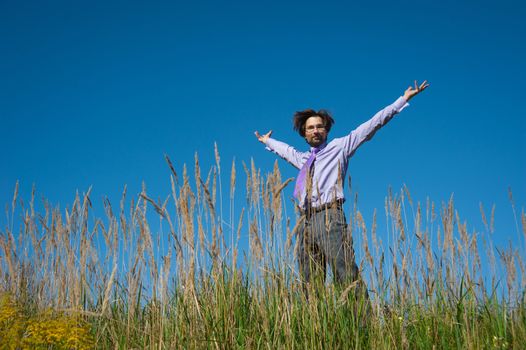 business man jumping on a background of blue sky