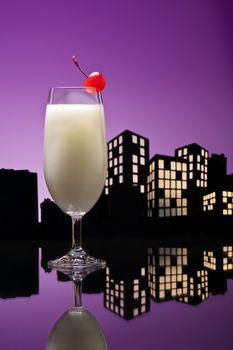 Metropolis Pina colada cocktail in city skyline setting