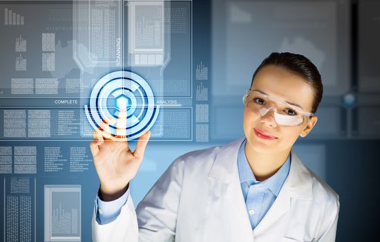 Image of young woman scientist touching icon of media screen