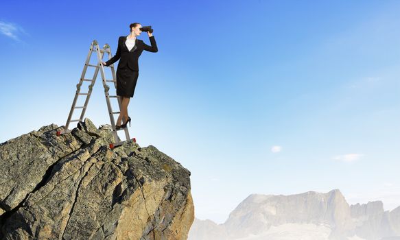 Image of businesswoman standing on ladder and looking in binoculars