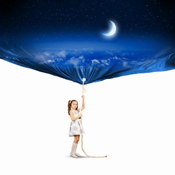 Image of little girl pulling banner with night illustration