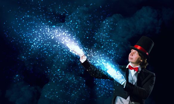 Image of wizard in red bow tie showing tricks