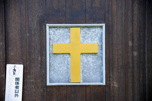 Cross on wooden door2