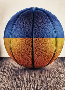 Close up of an old leather basketball with Ukraine flag