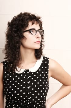 Portrait of a pensive woman in a vintage dress.