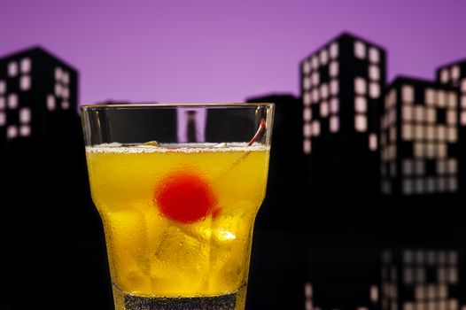 Skrew Driver cocktail in city skyline setting