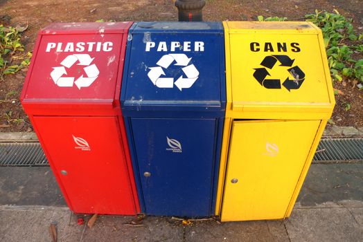 Multi coloured recyclling bins for plastic, paper and cans