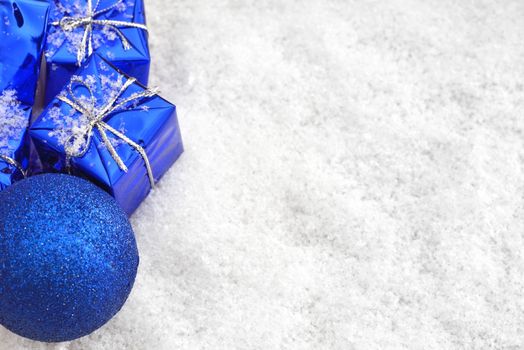 Blue Christmas gifts in the snow