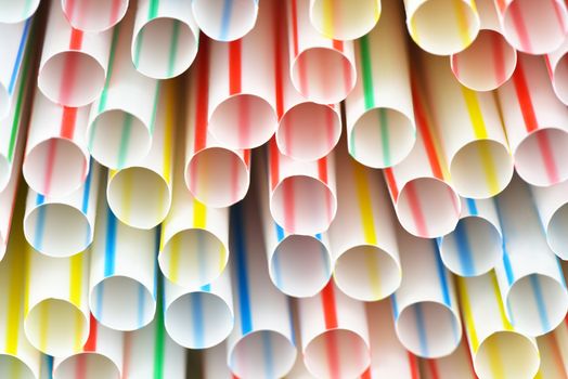 Many colorful drinking straws