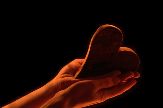 Heart in female hands