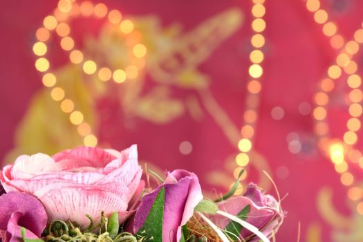 Pink background with lights and a flower